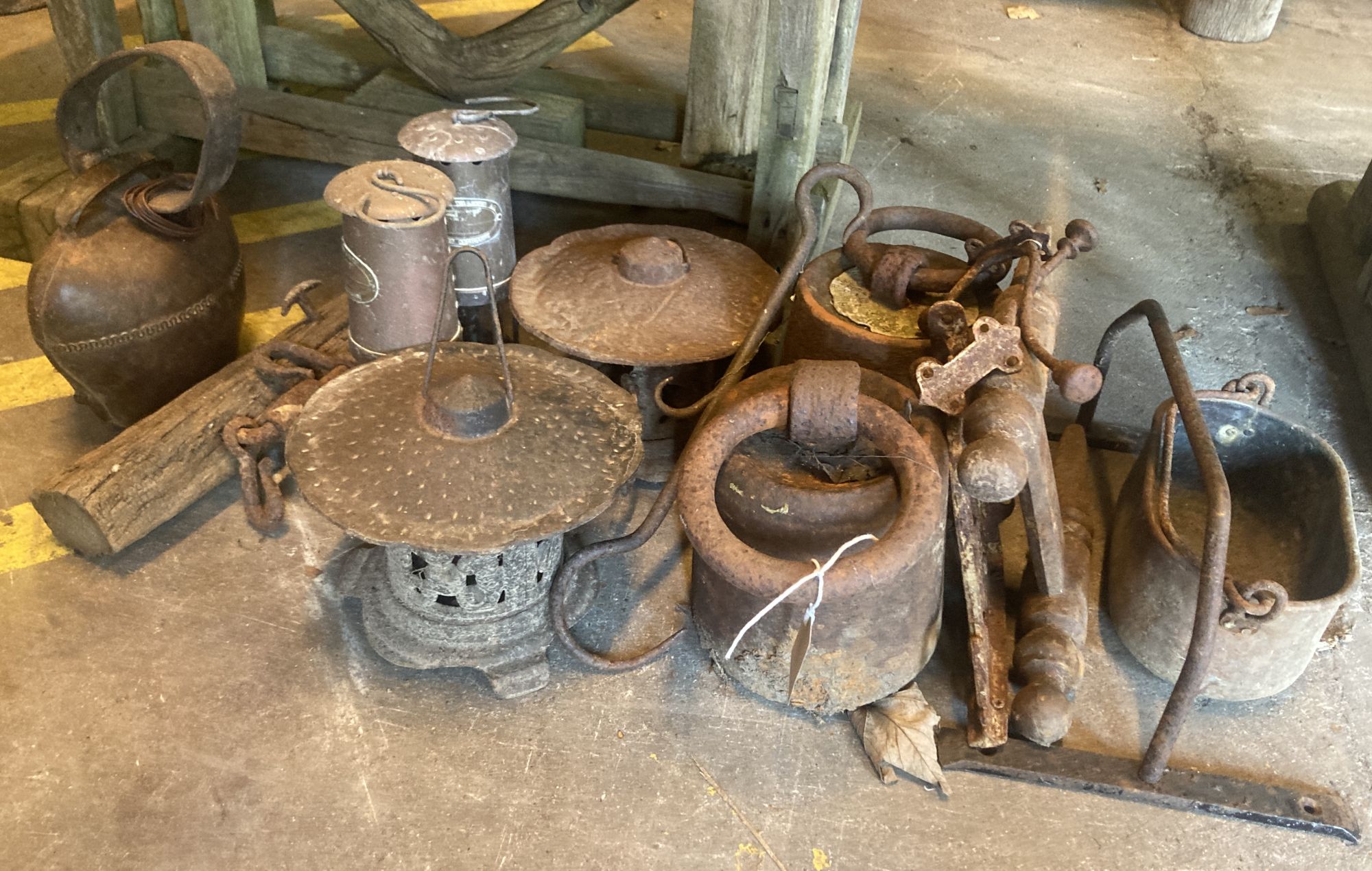 A quantity of Victorian and later metalware to include a cow bell, lanterns, miners lamps etc.
